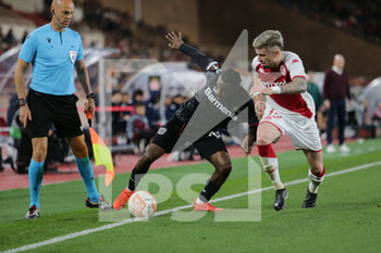 2023-02-23 - Jeremie Frimpong of Bayer 04 Leverkusen and Caio Henrique of As Monaco during the Uefa Europa League, football match between As Monaco and Bayer 04 Leverkusen,on 23 February 2023 at State Luis II in Monaco, Photo Ndrerim Kaceli - AS MONACO VS BAYER LEVERKUSEN - UEFA EUROPA LEAGUE - SOCCER