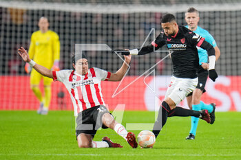 2023-02-23 - Erick Gutierrez of PSV challenges Youssef En-Nesyri of Sevilla FC during the UEFA Europa League, Play-off, 2nd leg football match between PSV and Sevilla FC on February 23, 2023 at the Philips Stadion in Eindhoven, Netherlands - FOOTBALL - EUROPA LEAGUE - PSV V SEVILLA FC - UEFA EUROPA LEAGUE - SOCCER