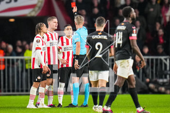 2023-02-23 - Xavi Simons of PSV, Joey Veerman of PSV look on while Mauro Junior of PSV receives a straight red card from referee Daniele Orsato during the UEFA Europa League, Play-off, 2nd leg football match between PSV and Sevilla FC on February 23, 2023 at the Philips Stadion in Eindhoven, Netherlands - FOOTBALL - EUROPA LEAGUE - PSV V SEVILLA FC - UEFA EUROPA LEAGUE - SOCCER