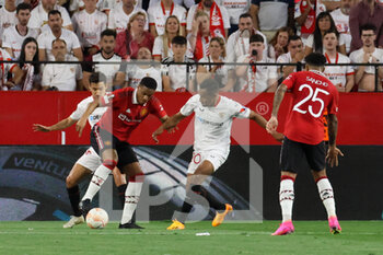 2023-04-20 - Anthony Martial (#9 - Manchester United) vies the ball with Fernando (#20 - Sevilla FC) and Jesus Navas (#16 - Sevilla FC) - SEVILLA FC VS MANCHESTER UNITED - UEFA EUROPA LEAGUE - SOCCER