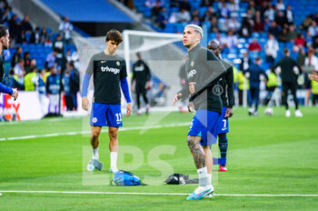 2023-04-12 - Enzo Fernández (Chelsea) and João Félix (Chelsea) warming up before the football match between
Real Madrid and Chelsea valid for the first leg of the quarter final of the Uefa Champion’s League celebrated in Madrid, Spain at Bernabeu stadium on Tuesday 12 March 2023 - QUARTER FINALS - REAL MADRID FC VS CHELSEA FC - UEFA CHAMPIONS LEAGUE - SOCCER