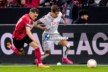 2023-05-18 - Florian Wirtz of Bayer 04 Leverkusen battle for possession with Nicola Zalewski of AS Roma during the UEFA Europa League, Semi-finals, 2nd leg football match between Bayer 04 Leverkusen and AS Roma on May 18, 2023 at BayArena in Leverkusen, Germany - FOOTBALL - EUROPA LEAGUE - LEVERKUSEN V ROMA - UEFA EUROPA LEAGUE - SOCCER