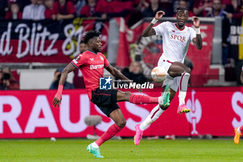 2023-05-18 - Edmond Tapsoba of Bayer 04 Leverkusen battle for possession with Tammy Abraham of AS Roma during the UEFA Europa League, Semi-finals, 2nd leg football match between Bayer 04 Leverkusen and AS Roma on May 18, 2023 at BayArena in Leverkusen, Germany - FOOTBALL - EUROPA LEAGUE - LEVERKUSEN V ROMA - UEFA EUROPA LEAGUE - SOCCER