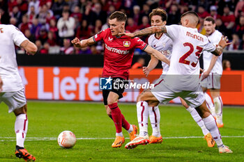 2023-05-18 - Florian Wirtz of Bayer 04 Leverkusen battle for possession with Gianluca Mancini of AS Roma during the UEFA Europa League, Semi-finals, 2nd leg football match between Bayer 04 Leverkusen and AS Roma on May 18, 2023 at BayArena in Leverkusen, Germany - FOOTBALL - EUROPA LEAGUE - LEVERKUSEN V ROMA - UEFA EUROPA LEAGUE - SOCCER