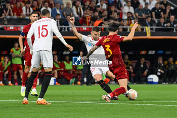 2023-05-31 - Sevilla FC’s Ivan Rakitic and AS Roma’s Roger Ibanez during Europe League final soccer match between AS Roma vs. Sevilla at the Puskas Arena in Budapest, Hungary, 31st of May 2023 - FINAL - SEVILLA FC VS AS ROMA - UEFA EUROPA LEAGUE - SOCCER
