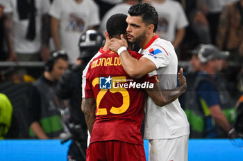 2023-05-31 - Sevilla FC’s Alex Telles hugs AS Roma’s Georginio Wijnaldum after the Europe League final soccer match between AS Roma vs. Sevilla at the Puskas Arena in Budapest, Hungary, 31st of May 2023 won by Sevilla FC - FINAL - SEVILLA FC VS AS ROMA - UEFA EUROPA LEAGUE - SOCCER