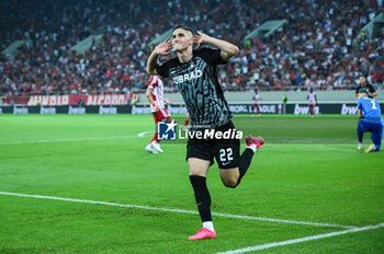2023-09-21 - 22 Roland Sallai of SC Freiburg after scoring a goal during the Europa League Group A match between Olympiacos FC and SC Freiburg at Georgios Karaiskakis Stadium on September 21, 2023, in Athens, Greece. - OLYMPIACOS VS FREIBURG, EUROPA LEAGUE, GROUP A - UEFA EUROPA LEAGUE - SOCCER