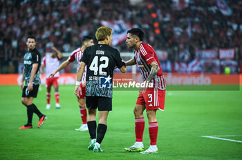 2023-09-21 - 42 Ritsu Doan of SC Freiburg competing with 3 Francisco Ortega of Olympiacos FC during the Europa League Group A match between Olympiacos FC and SC Freiburg at Georgios Karaiskakis Stadium on September 21, 2023, in Athens, Greece. - OLYMPIACOS VS FREIBURG, EUROPA LEAGUE, GROUP A - UEFA EUROPA LEAGUE - SOCCER