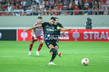 2023-09-21 - 32 Vincenzo Grifo of SC Freiburg scoring a penalty during the Europa League Group A match between Olympiacos FC and SC Freiburg at Georgios Karaiskakis Stadium on September 21, 2023, in Athens, Greece. - OLYMPIACOS VS FREIBURG, EUROPA LEAGUE, GROUP A - UEFA EUROPA LEAGUE - SOCCER