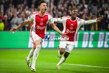 2023-09-21 - Steven BERGHUIS of Amsterdam celebrate his goal with Jorrel HATO of Amsterdam during the UEFA League Europa, Group B football match between Ajax Amsterdam and Olympique de Marseille on September 21, 2023 at Johan Cruijff ArenA stadium in Amsterdam, Netherlands - FOOTBALL - UEFA EUROPA LEAGUE - AJAX V MARSEILLE - UEFA EUROPA LEAGUE - SOCCER