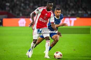 2023-09-21 - Carlos BORGES of Amsterdam and Iliman NDIAYE of Marseille during the UEFA League Europa, Group B football match between Ajax Amsterdam and Olympique de Marseille on September 21, 2023 at Johan Cruijff ArenA stadium in Amsterdam, Netherlands - FOOTBALL - UEFA EUROPA LEAGUE - AJAX V MARSEILLE - UEFA EUROPA LEAGUE - SOCCER