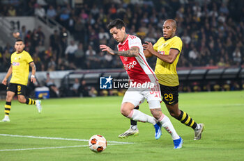 2023-10-05 - 30 Gaston Avila of Ajax competing with 29 Djibril Sidibe of AEK during the UEFA Europa League, Group B match between AEK FC and Ajax at Opap Arena on October 5, 2023, in Athens, Greece. - UEFA EUROPA LEAGUE - AEK FC VS AJAX, EUROPA LEAGUE, GROUP B - UEFA EUROPA LEAGUE - SOCCER
