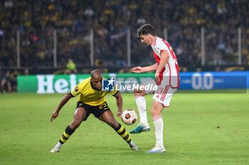 2023-10-05 - 33 Benjamin Tahirovic of Ajax competing with 29 Djibril Sidibe of AEK during the UEFA Europa League, Group B match between AEK FC and Ajax at Opap Arena on October 5, 2023, in Athens, Greece. - UEFA EUROPA LEAGUE - AEK FC VS AJAX, EUROPA LEAGUE, GROUP B - UEFA EUROPA LEAGUE - SOCCER