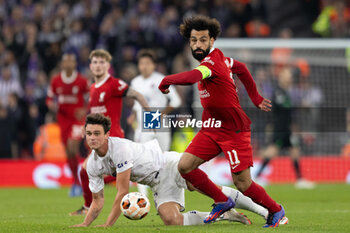2023-10-26 - Liverpool forward Mohamed Salah (11) and Rasmus Nicolaisen of Toulouse during the UEFA Europa League, Group E football match between Liverpool FC and Toulouse FC on October 26, 2023 at Anfield in Liverpool, England - FOOTBALL - EUROPA LEAGUE - LIVERPOOL V TOULOUSE - UEFA EUROPA LEAGUE - SOCCER