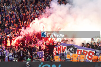 2023-10-26 - Toulouse fans, supporters light flares during the UEFA Europa League, Group E football match between Liverpool FC and Toulouse FC on October 26, 2023 at Anfield in Liverpool, England - FOOTBALL - EUROPA LEAGUE - LIVERPOOL V TOULOUSE - UEFA EUROPA LEAGUE - SOCCER