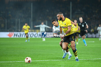 2023-11-09 - 2 Harold Moukoudi of AEK FC competing with 29 Iliman Ndiaye of Marseille during the UEFA Europa League, Group B match between AEK FC and Marseille at Opap Arena on November 9, 2023, in Athens, Greece. - AEK FC VS MARSEILLE - UEFA EUROPA LEAGUE, GROUP B - UEFA EUROPA LEAGUE - SOCCER