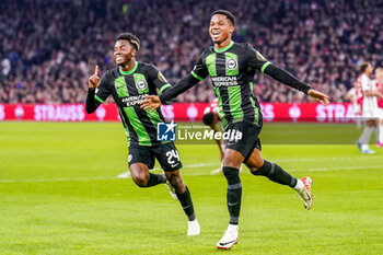 2023-11-09 - Ansu Fati of Brighton & Hove Albion celebrates his goal 0-1 with Simon Adingra during the UEFA Europa League, Group B football match between AFC Ajax and Brighton & Hove Albion on November 9, 2023 at the Johan Cruyff ArenA in Amsterdam, Netherlands - FOOTBALL - EUROPA LEAGUE - AJAX V BRIGHTON - UEFA EUROPA LEAGUE - SOCCER