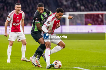 2023-11-09 - Chuba Akpom of AFC Ajax and Pervis Estupinan of Brighton & Hove Albion during the UEFA Europa League, Group B football match between AFC Ajax and Brighton & Hove Albion on November 9, 2023 at the Johan Cruyff ArenA in Amsterdam, Netherlands - FOOTBALL - EUROPA LEAGUE - AJAX V BRIGHTON - UEFA EUROPA LEAGUE - SOCCER