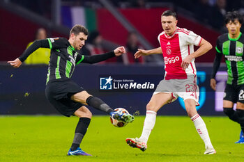2023-11-09 - Pascal Gross of Brighton & Hove Albion and Steven Berghuis of AFC Ajax during the UEFA Europa League, Group B football match between AFC Ajax and Brighton & Hove Albion on November 9, 2023 at the Johan Cruyff ArenA in Amsterdam, Netherlands - FOOTBALL - EUROPA LEAGUE - AJAX V BRIGHTON - UEFA EUROPA LEAGUE - SOCCER
