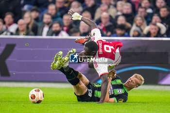 2023-11-09 - Jan Paul van Hecke of Brighton & Hove Albion with a foul on Brian Brobbey of AFC Ajax during the UEFA Europa League, Group B football match between AFC Ajax and Brighton & Hove Albion on November 9, 2023 at the Johan Cruyff ArenA in Amsterdam, Netherlands - FOOTBALL - EUROPA LEAGUE - AJAX V BRIGHTON - UEFA EUROPA LEAGUE - SOCCER