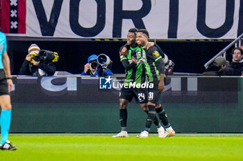 2023-11-09 - Simon Adingra (24) of Brighton & Hove Albion celebrates his goal with Ansu Fati 0-2 during the UEFA Europa League, Group B football match between AFC Ajax and Brighton & Hove Albion on November 9, 2023 at the Johan Cruyff ArenA in Amsterdam, Netherlands - FOOTBALL - EUROPA LEAGUE - AJAX V BRIGHTON - UEFA EUROPA LEAGUE - SOCCER