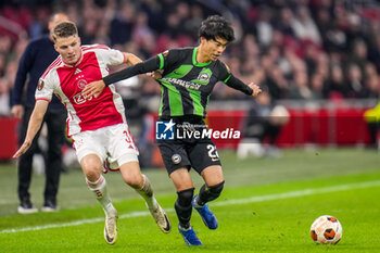 2023-11-09 - Kaoru Mitoma of Brighton & Hove Albion and Anton Gaaei of AFC Ajax during the UEFA Europa League, Group B football match between AFC Ajax and Brighton & Hove Albion on November 9, 2023 at the Johan Cruyff ArenA in Amsterdam, Netherlands - FOOTBALL - EUROPA LEAGUE - AJAX V BRIGHTON - UEFA EUROPA LEAGUE - SOCCER