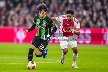 2023-11-09 - Kaoru Mitoma of Brighton & Hove Albion and Silvano Vos of AFC Ajax during the UEFA Europa League, Group B football match between AFC Ajax and Brighton & Hove Albion on November 9, 2023 at the Johan Cruyff ArenA in Amsterdam, Netherlands - FOOTBALL - EUROPA LEAGUE - AJAX V BRIGHTON - UEFA EUROPA LEAGUE - SOCCER