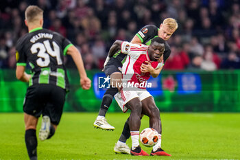 2023-11-09 - Brian Brobbey of AFC Ajax and Jan Paul van Hecke of Brighton & Hove Albion during the UEFA Europa League, Group B football match between AFC Ajax and Brighton & Hove Albion on November 9, 2023 at the Johan Cruyff ArenA in Amsterdam, Netherlands - FOOTBALL - EUROPA LEAGUE - AJAX V BRIGHTON - UEFA EUROPA LEAGUE - SOCCER