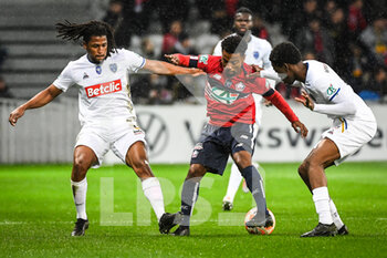 2023-01-08 - Yasser LAROUCI of ESTAC Troyes, Angel GOMES of Lille and Derek MAZOU-SACKO of ESTAC Troyes during the French Cup, round of 64 football match between LOSC Lille and ESTAC Troyes on January 8, 2023 at Pierre Mauroy stadium in Villeneuve-d'Ascq, France - FOOTBALL - FRENCH CUP - LILLE V TROYES - FRENCH CUP - SOCCER