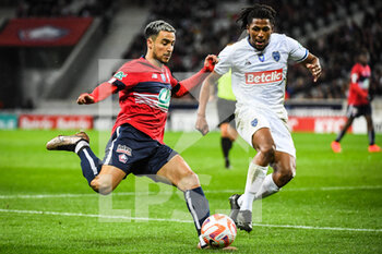 2023-01-08 - Adam OUNAS of Lille and Yasser LAROUCI of ESTAC Troyes during the French Cup, round of 64 football match between LOSC Lille and ESTAC Troyes on January 8, 2023 at Pierre Mauroy stadium in Villeneuve-d'Ascq, France - FOOTBALL - FRENCH CUP - LILLE V TROYES - FRENCH CUP - SOCCER