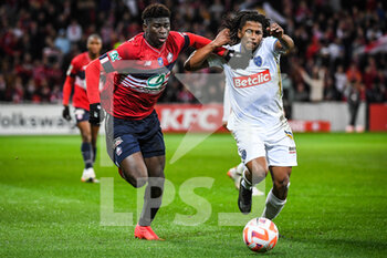 2023-01-08 - Carlos BALEBA of Lille and Yasser LAROUCI of ESTAC Troyes during the French Cup, round of 64 football match between LOSC Lille and ESTAC Troyes on January 8, 2023 at Pierre Mauroy stadium in Villeneuve-d'Ascq, France - FOOTBALL - FRENCH CUP - LILLE V TROYES - FRENCH CUP - SOCCER