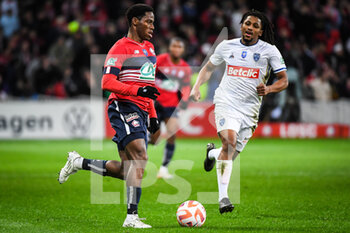 2023-01-08 - Jonathan DAVID of Lille and Yasser LAROUCI of ESTAC Troyes during the French Cup, round of 64 football match between LOSC Lille and ESTAC Troyes on January 8, 2023 at Pierre Mauroy stadium in Villeneuve-d'Ascq, France - FOOTBALL - FRENCH CUP - LILLE V TROYES - FRENCH CUP - SOCCER
