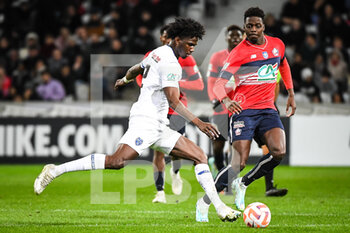 2023-01-08 - Jackson POROZO of ESTAC Troyes and Mohamed BAYO of Lille during the French Cup, round of 64 football match between LOSC Lille and ESTAC Troyes on January 8, 2023 at Pierre Mauroy stadium in Villeneuve-d'Ascq, France - FOOTBALL - FRENCH CUP - LILLE V TROYES - FRENCH CUP - SOCCER