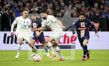 2023-02-09 - Samuel Gigot of Marseille between Valentin Rongier of Marseille and Lionel Messi of PSG during the French Cup round of 16 football match between Olympique de Marseille (OM) and Paris Saint-Germain (PSG) on February 8, 2023 at Stade Velodrome in Marseille, France - FOOTBALL - FRENCH CUP - MARSEILLE V PARIS SG - FRENCH CUP - SOCCER