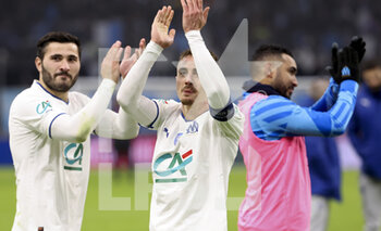 2023-02-09 - Sead Kolasinac, Valentin Rongier, Dimitri Payet of Marseille celebrate the victory following the French Cup round of 16 football match between Olympique de Marseille (OM) and Paris Saint-Germain (PSG) on February 8, 2023 at Stade Velodrome in Marseille, France - FOOTBALL - FRENCH CUP - MARSEILLE V PARIS SG - FRENCH CUP - SOCCER