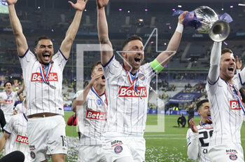 2023-04-29 - Gabriel Suazo, Brecht Dejaegere, Branco Van Den Boomen of Toulouse celebrate the victory following the French Cup Final 2023 football match between FC Nantes and Toulouse FC (TFC, Tefece) on April 29, 2023 at Stade de France in Saint-Denis near Paris, France - FOOTBALL - FRENCH CUP - FINAL - NANTES V TOULOUSE - FRENCH CUP - SOCCER