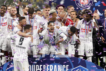 2023-04-29 - Fares Chaibi of Toulouse celebrates with teammates during the trophy ceremony following the French Cup Final 2023 football match between FC Nantes and Toulouse FC (TFC, Tefece) on April 29, 2023 at Stade de France in Saint-Denis near Paris, France - FOOTBALL - FRENCH CUP - FINAL - NANTES V TOULOUSE - FRENCH CUP - SOCCER
