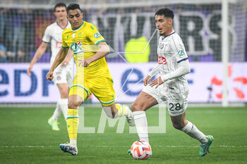 2023-04-29 - Mostafa MOHAMED of Nantes and Fares CHAIBI of Toulouse during the French Cup, Final football match between FC Nantes and Toulouse FC on April 29, 2023 at Stade de France in Saint-Denis near Paris, France - FOOTBALL - FRENCH CUP - FINAL - NANTES V TOULOUSE - FRENCH CUP - SOCCER