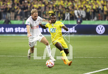 2023-04-29 - Mikkel Desler Puggaard of Toulouse, Moses Simon of Nantes during the French Cup Final 2023 football match between FC Nantes and Toulouse FC (TFC, Tefece) on April 29, 2023 at Stade de France in Saint-Denis near Paris, France - FOOTBALL - FRENCH CUP - FINAL - NANTES V TOULOUSE - FRENCH CUP - SOCCER