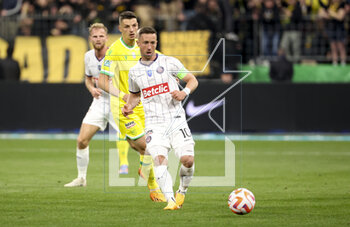 2023-04-29 - Brecht Dejaegere of Toulouse, left Andrei Girotto of Nantes during the French Cup Final 2023 football match between FC Nantes and Toulouse FC (TFC, Tefece) on April 29, 2023 at Stade de France in Saint-Denis near Paris, France - FOOTBALL - FRENCH CUP - FINAL - NANTES V TOULOUSE - FRENCH CUP - SOCCER