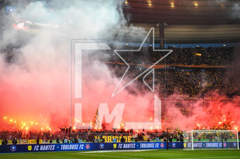 2023-04-29 - Supporters of Nantes using smoke bombs during the French Cup, Final football match between FC Nantes and Toulouse FC on April 29, 2023 at Stade de France in Saint-Denis near Paris, France - FOOTBALL - FRENCH CUP - FINAL - NANTES V TOULOUSE - FRENCH CUP - SOCCER