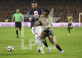 2023-01-01 - Lois Openda of Lens, Sergio Ramos of PSG (left) during the French championship Ligue 1 football match between RC Lens and Paris Saint-Germain on January 1, 2023 at Bollaert-Delelis stadium in Lens, France - FOOTBALL - FRENCH CHAMP - LENS V PARIS SG - FRENCH LIGUE 1 - SOCCER
