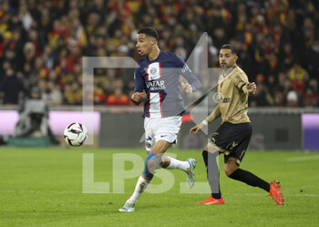 2023-01-01 - Hugo Ekitike of PSG, Alexis Claude Maurice of Lens during the French championship Ligue 1 football match between RC Lens and Paris Saint-Germain on January 1, 2023 at Bollaert-Delelis stadium in Lens, France - FOOTBALL - FRENCH CHAMP - LENS V PARIS SG - FRENCH LIGUE 1 - SOCCER