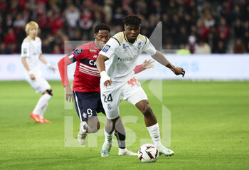 02/01/2023 - Emmanuel Agbadou of Reims, Jonathan David of Lille (left) during the French championship Ligue 1 football match between LOSC Lille (LOSC) and Stade de Reims on January 2, 2023 at Stade Pierre Mauroy in Villeneuve-d'Ascq near Lille, France - FOOTBALL - FRENCH CHAMP - LILLE V REIMS - FRENCH LIGUE 1 - CALCIO