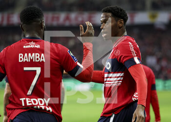 02/01/2023 - Jonathan David of Lille celebrates his goal with Jonathan Bamba (left) during the French championship Ligue 1 football match between LOSC Lille (LOSC) and Stade de Reims on January 2, 2023 at Stade Pierre Mauroy in Villeneuve-d'Ascq near Lille, France - FOOTBALL - FRENCH CHAMP - LILLE V REIMS - FRENCH LIGUE 1 - CALCIO