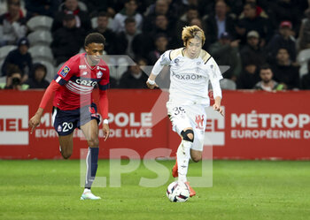 02/01/2023 - Ito Junya of Reims, Angel Gomes of Lille (left) during the French championship Ligue 1 football match between LOSC Lille (LOSC) and Stade de Reims on January 2, 2023 at Stade Pierre Mauroy in Villeneuve-d'Ascq near Lille, France - FOOTBALL - FRENCH CHAMP - LILLE V REIMS - FRENCH LIGUE 1 - CALCIO