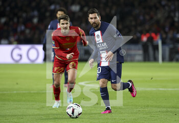 2023-01-11 - Lionel Messi of PSG, Adrien Hunou of Angers (left) during the French championship Ligue 1 football match between Paris Saint-Germain (PSG) and SCO Angers on January 11, 2023 at Parc des Princes stadium in Paris, France - FOOTBALL - FRENCH CHAMP - PARIS SG V ANGERS - FRENCH LIGUE 1 - SOCCER