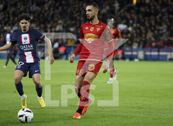 2023-01-11 - Nabil Bentaleb of Angers, Vitinha of PSG (left) during the French championship Ligue 1 football match between Paris Saint-Germain (PSG) and SCO Angers on January 11, 2023 at Parc des Princes stadium in Paris, France - FOOTBALL - FRENCH CHAMP - PARIS SG V ANGERS - FRENCH LIGUE 1 - SOCCER