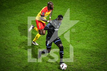 2023-01-14 - Rayan RAVELOSON of Auxerre and Seko FOFANA of Lens during the French championship Ligue 1 football match between RC Lens and AJ Auxerre on January 14, 2023 at Bollaert-Delelis stadium in Lens, France - FOOTBALL - FRENCH CHAMP - LENS V AUXERRE - FRENCH LIGUE 1 - SOCCER