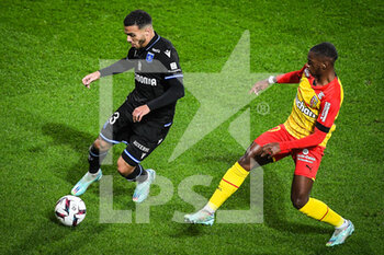 2023-01-14 - Akim ZEDADKA of Auxerre and David PEREIRA DA COSTA of Lens during the French championship Ligue 1 football match between RC Lens and AJ Auxerre on January 14, 2023 at Bollaert-Delelis stadium in Lens, France - FOOTBALL - FRENCH CHAMP - LENS V AUXERRE - FRENCH LIGUE 1 - SOCCER